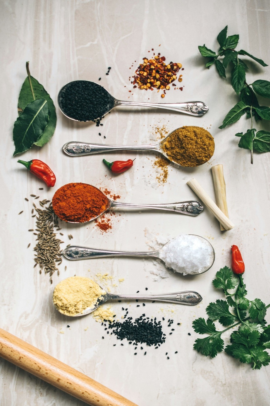 Ingredients and fresh herbs arranged for the fire.